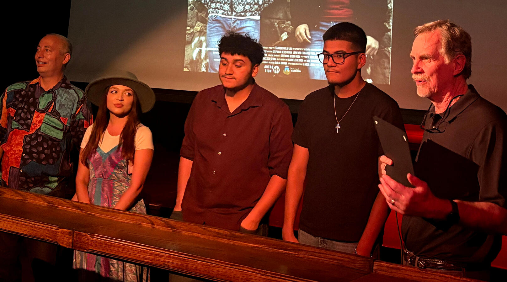 Bisbee mayor Ken Budge (far right) reads a Proclamation at the Royale Film Festival. Left to right: Festival host Danny Hercules, BHS film program founder Brianna Young, student filmmakers Maceo Pearson and Ernesto Suarez, and Mayor Budge. (Photo: Ponte)