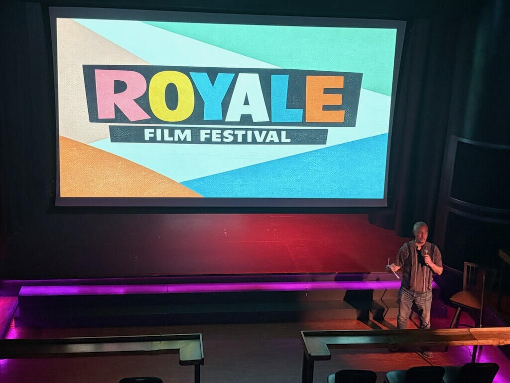 Festival host Danny Hercules explains how to fill out the ballots for the Royale Film Festival's first-ever Audience Choice Awards. (Photo by Yvette Ponte.)