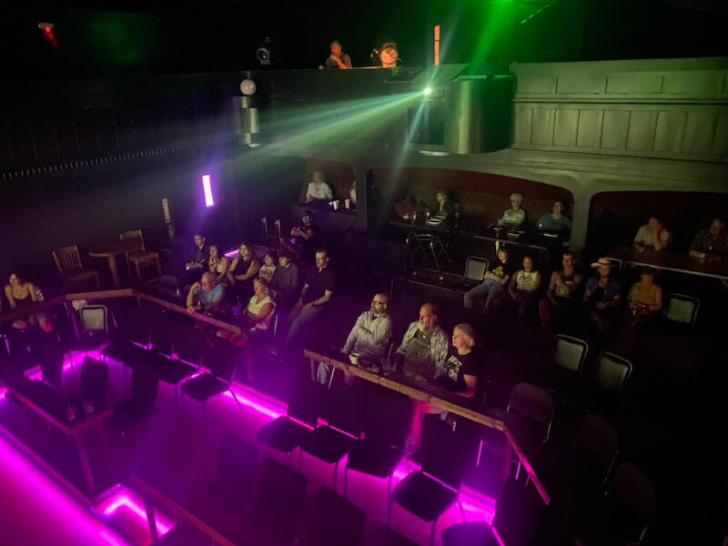 An audience watches award-winning films at the Royale Film Festival